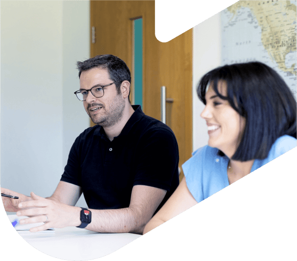 woman and man in an office setting having a meeting