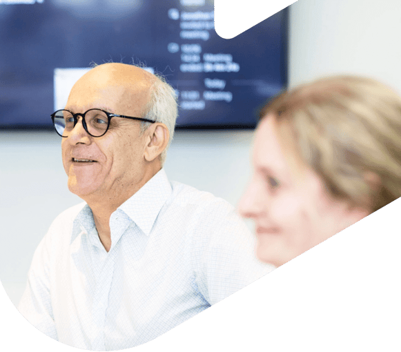 Woman and man in an office setting having a meeting